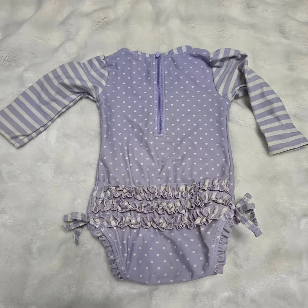 RuffleButts Baby Girl Lavender Heart Long Sleeve Rashguard Swim Ruffle One Piece